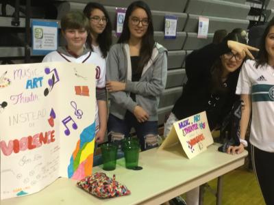 Students with project on art over violence